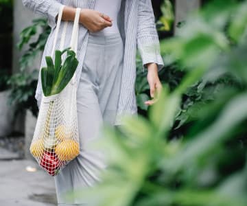 Women with a bag of vegetables